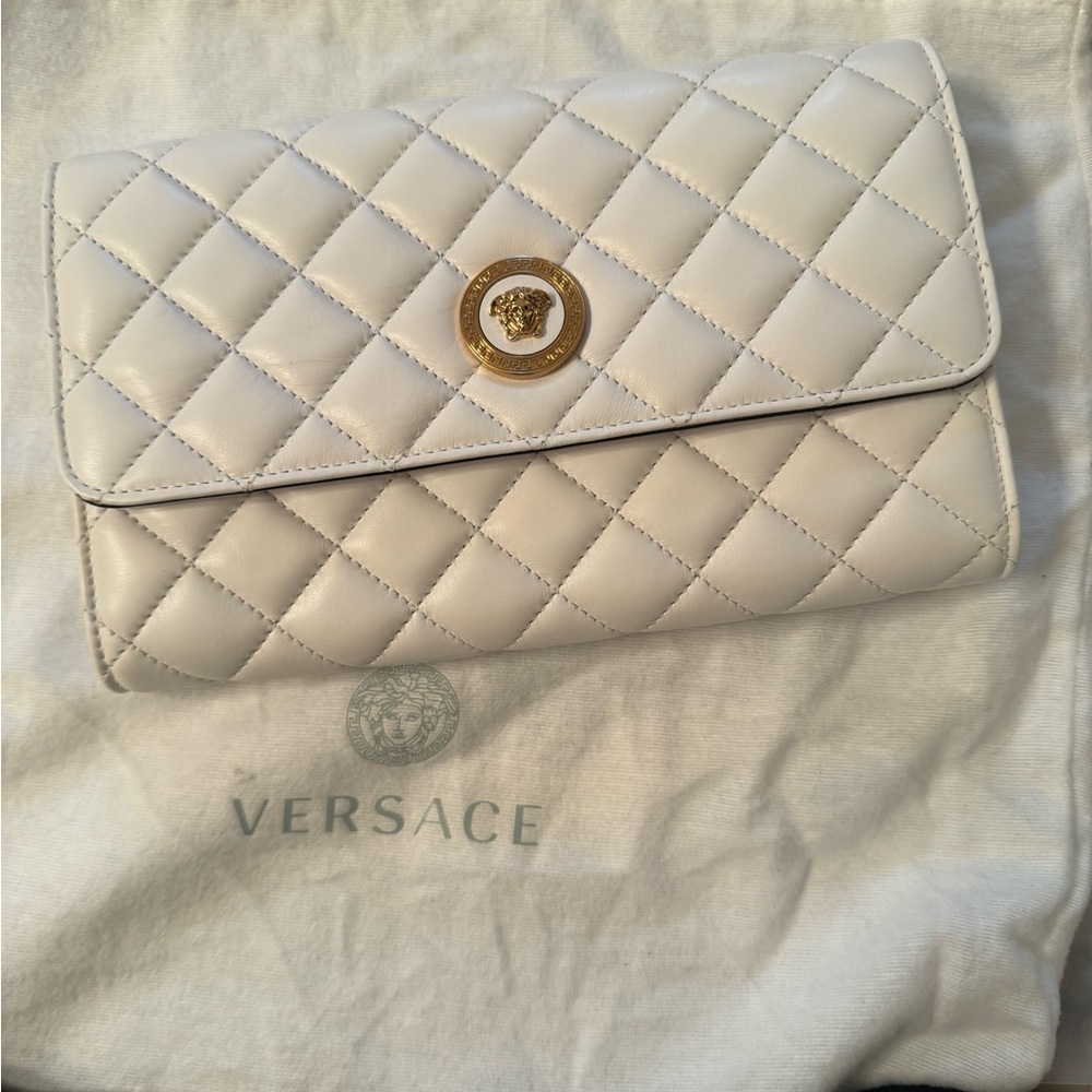 NWOT- Versace Medusa head white WOC (originally: $1813). Fits largest iPhone